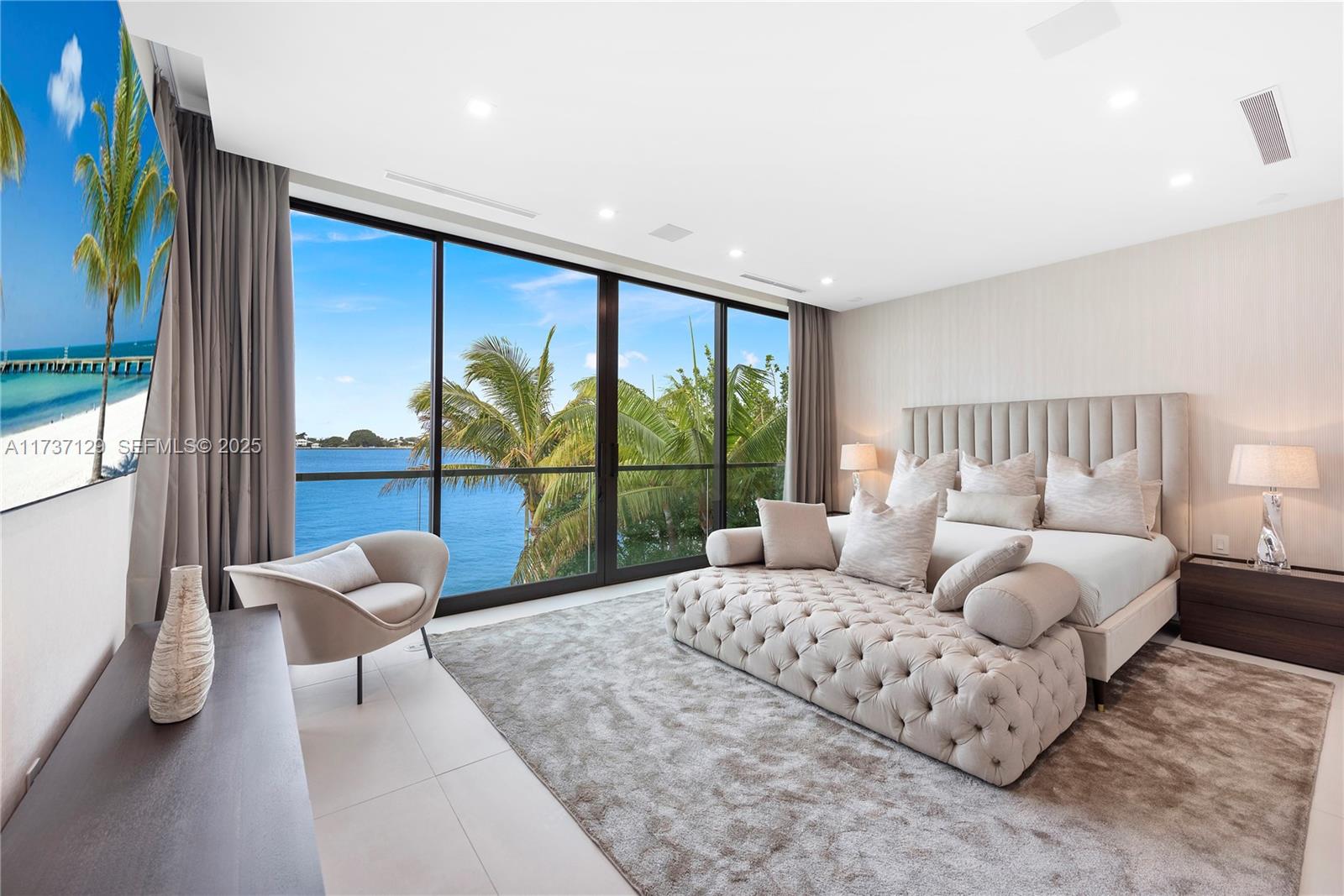 1785 Cleveland Road Miami Beach, FL 33141 - Photo 27 of 67 a bedroom with a bed and glass window