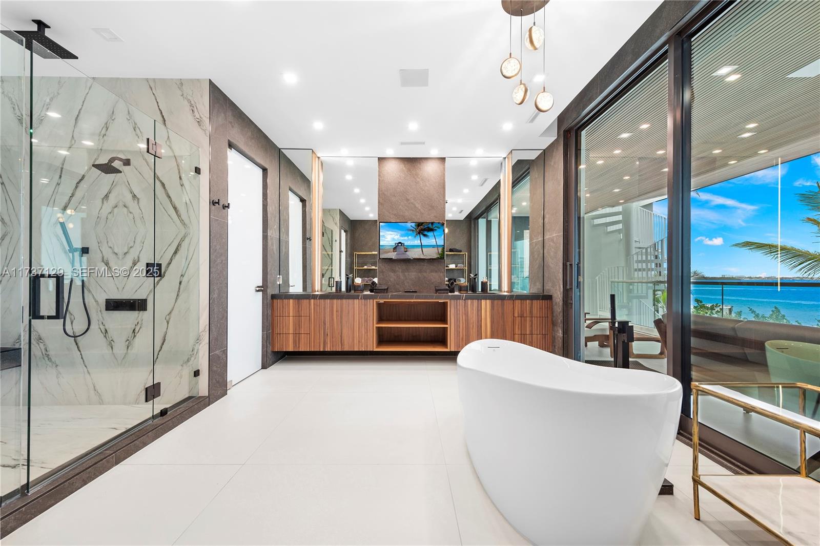 1785 Cleveland Road Miami Beach, FL 33141 - Photo 29 of 67 a living room with stainless steel appliances furniture and a chandelier