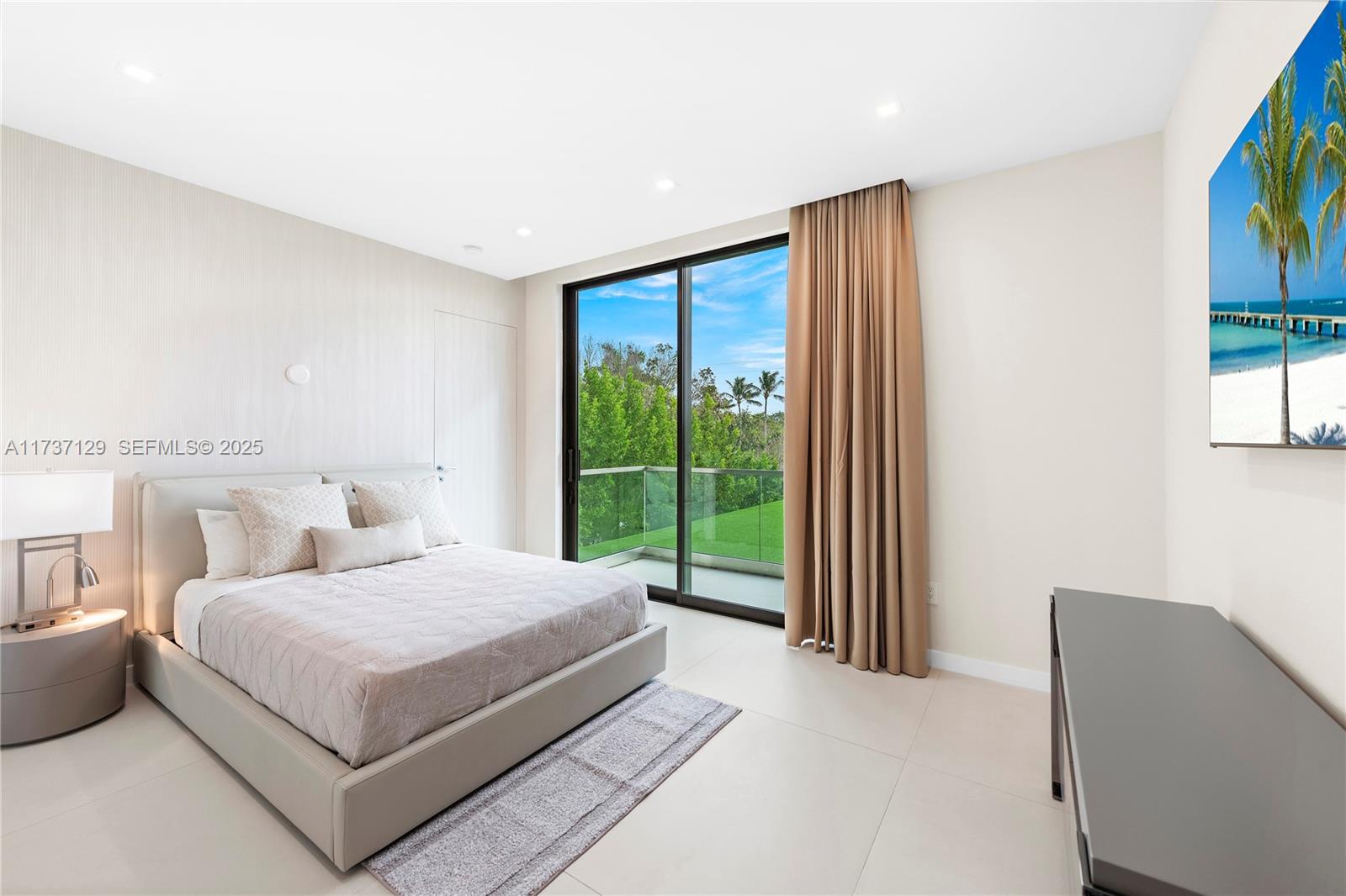 1785 Cleveland Road Miami Beach, FL 33141 - Photo 30 of 67 a bedroom with a large bed and a window