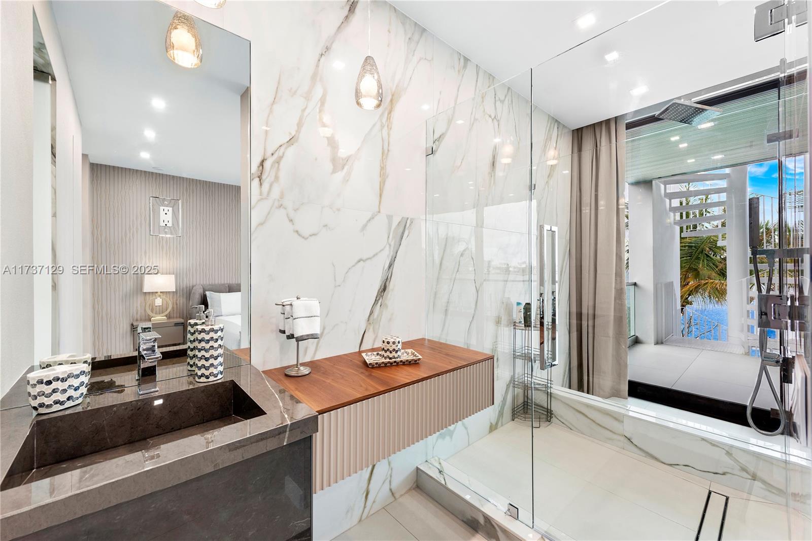 1785 Cleveland Road Miami Beach, FL 33141 - Photo 31 of 67 a room with stainless steel appliances kitchen island granite countertop a sink and cabinets