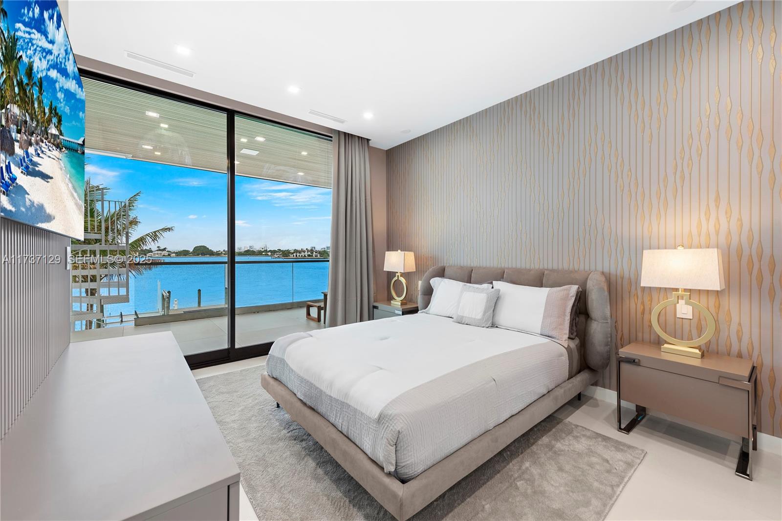 1785 Cleveland Road Miami Beach, FL 33141 - Photo 33 of 67 a bedroom with a large bed and a night stand