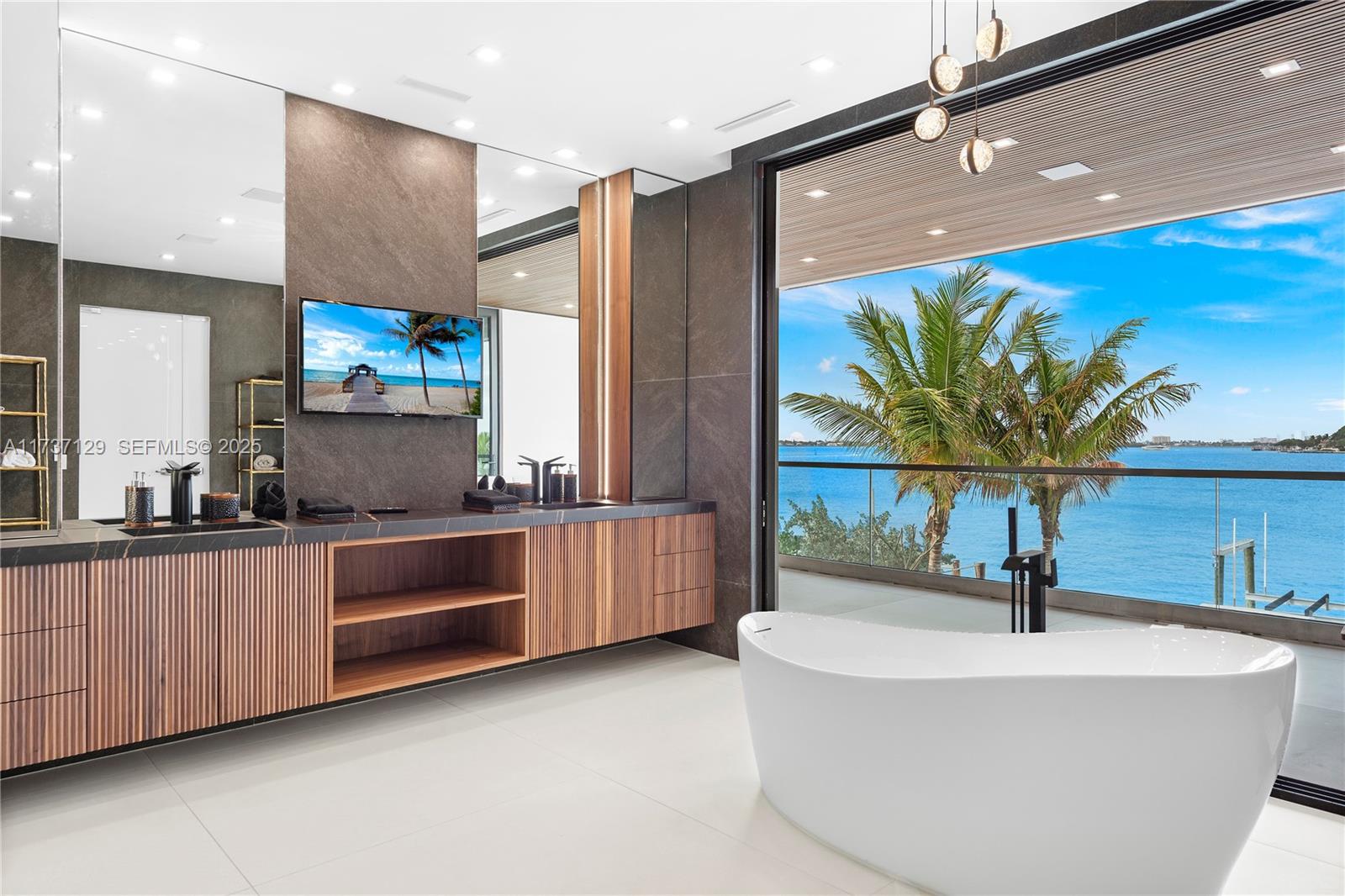 1785 Cleveland Road Miami Beach, FL 33141 - Photo 34 of 67 a kitchen with stainless steel appliances a sink and a large window