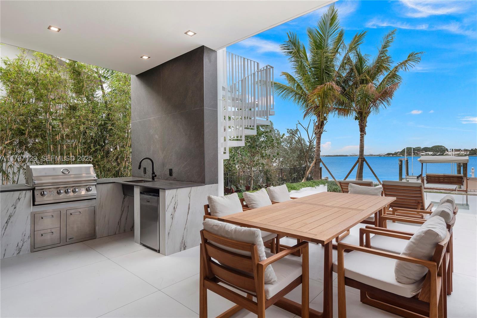 1785 Cleveland Road Miami Beach, FL 33141 - Photo 37 of 67 a view of a dining table and chairs in the patio