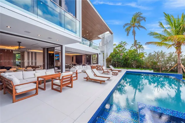 a view of swimming pool with outdoor seating