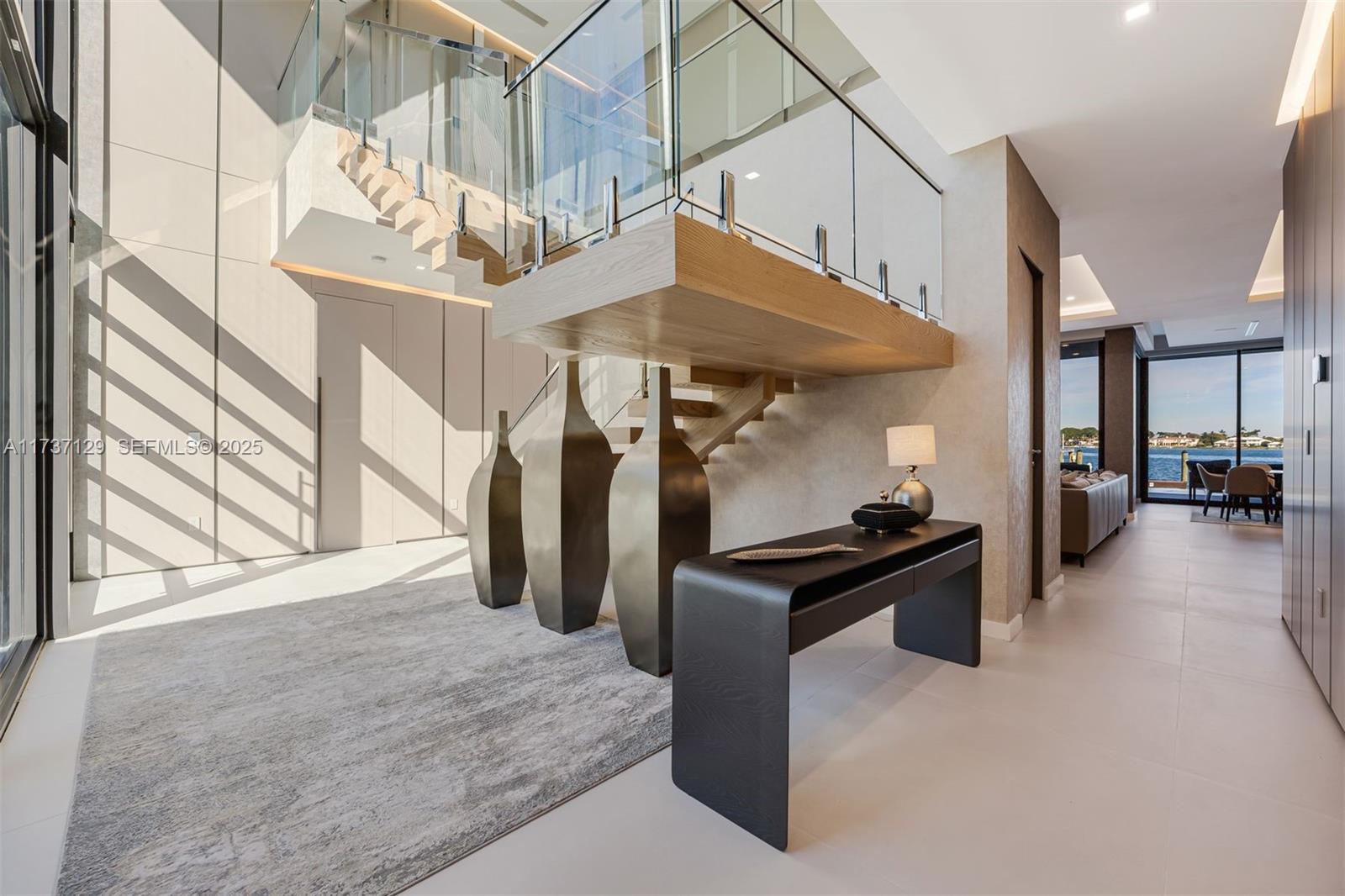 1785 Cleveland Road Miami Beach, FL 33141 - Photo 4 of 67 a kitchen with stainless steel appliances kitchen island granite countertop a refrigerator a stove and a sink with cabinets