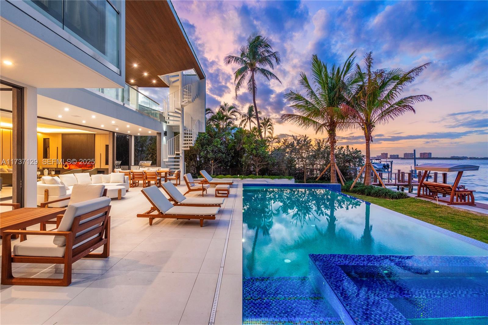 1785 Cleveland Road Miami Beach, FL 33141 - Photo 53 of 67 a view of a patio with couches and a table and chairs with wooden floor