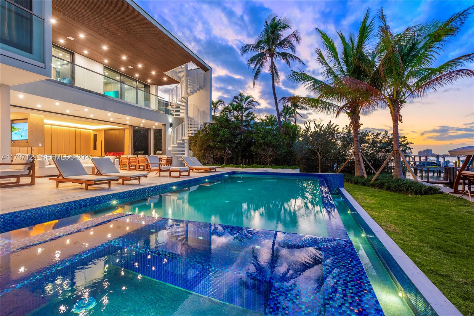 1785 Cleveland Road Miami Beach, FL 33141 - Photo 54 of 67 a view of a swimming pool with a table and chairs