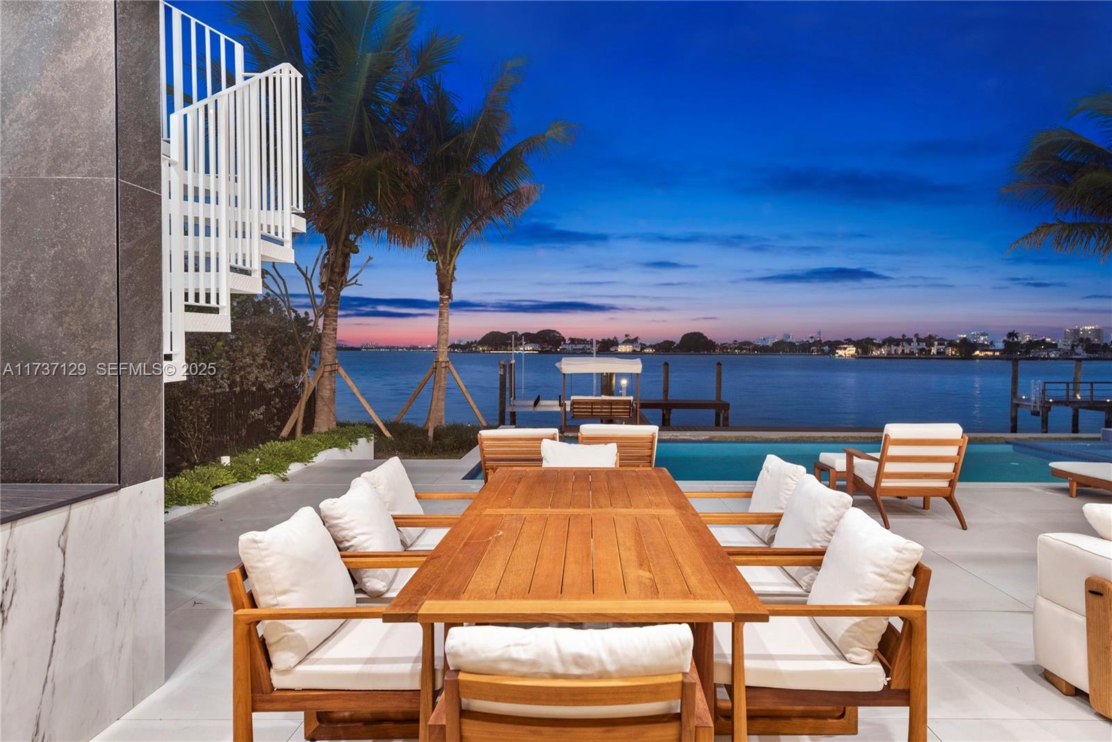 1785 Cleveland Road Miami Beach, FL 33141 - Photo 56 of 67 a view of a patio with table and chairs with wooden floor