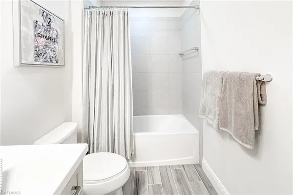 a bathroom with a bathtub and a toilet