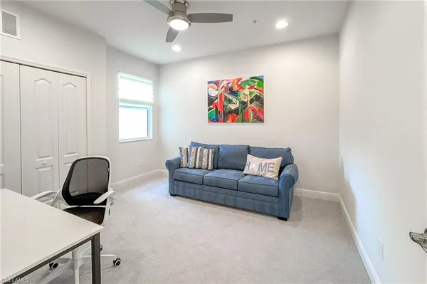 a living room with furniture and a window
