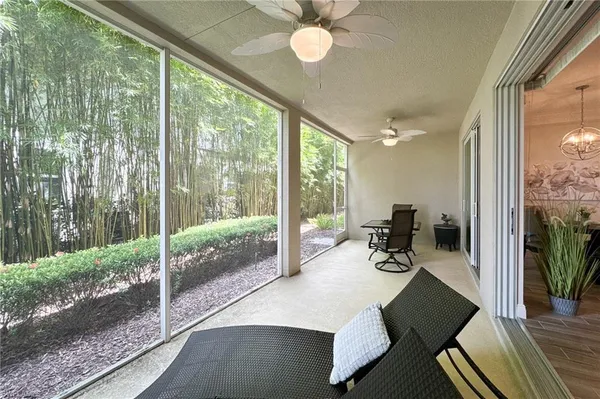 a view of a dining room with furniture wooden floor and fan