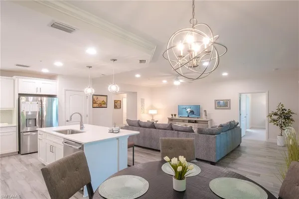 a kitchen with a dining table and chairs
