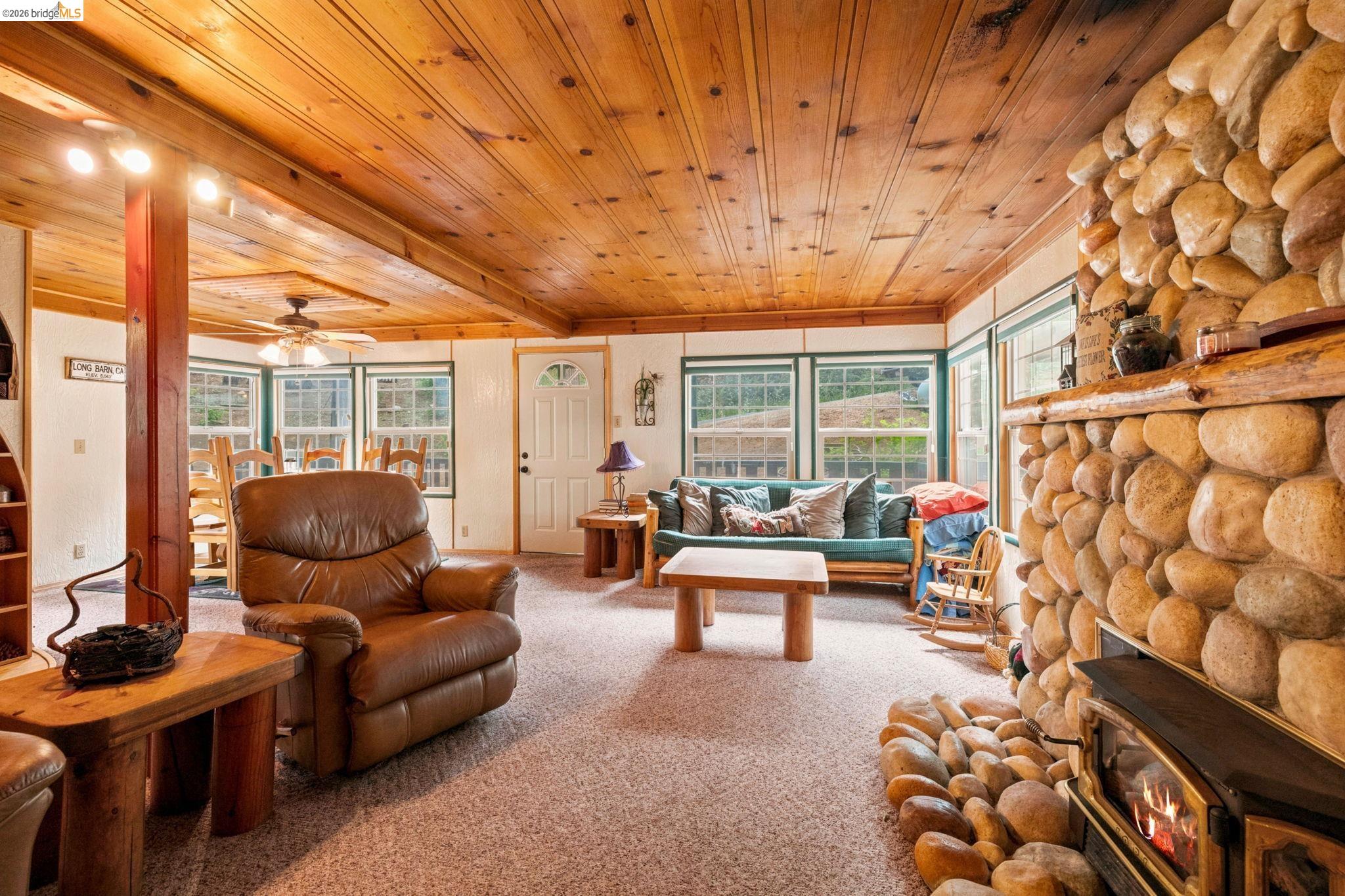 25822 Long Barn Sugar Pine Road Long Barn, CA 95335 - Photo 8 of 28 a living room with furniture and a large window