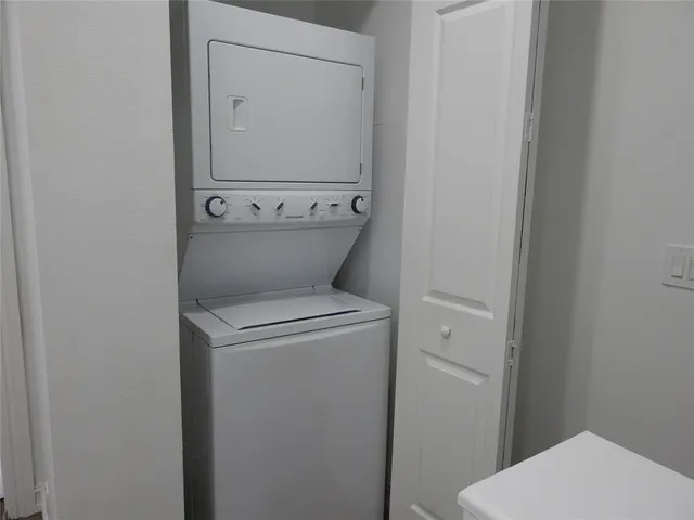 a bathroom with a toilet and a mirror