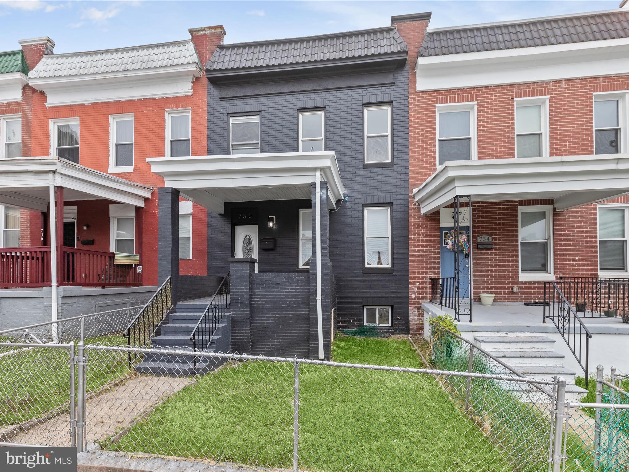 732 Edgewood Street Baltimore, MD 21229 - Photo 1 of 41 front view of a brick house with a yard
