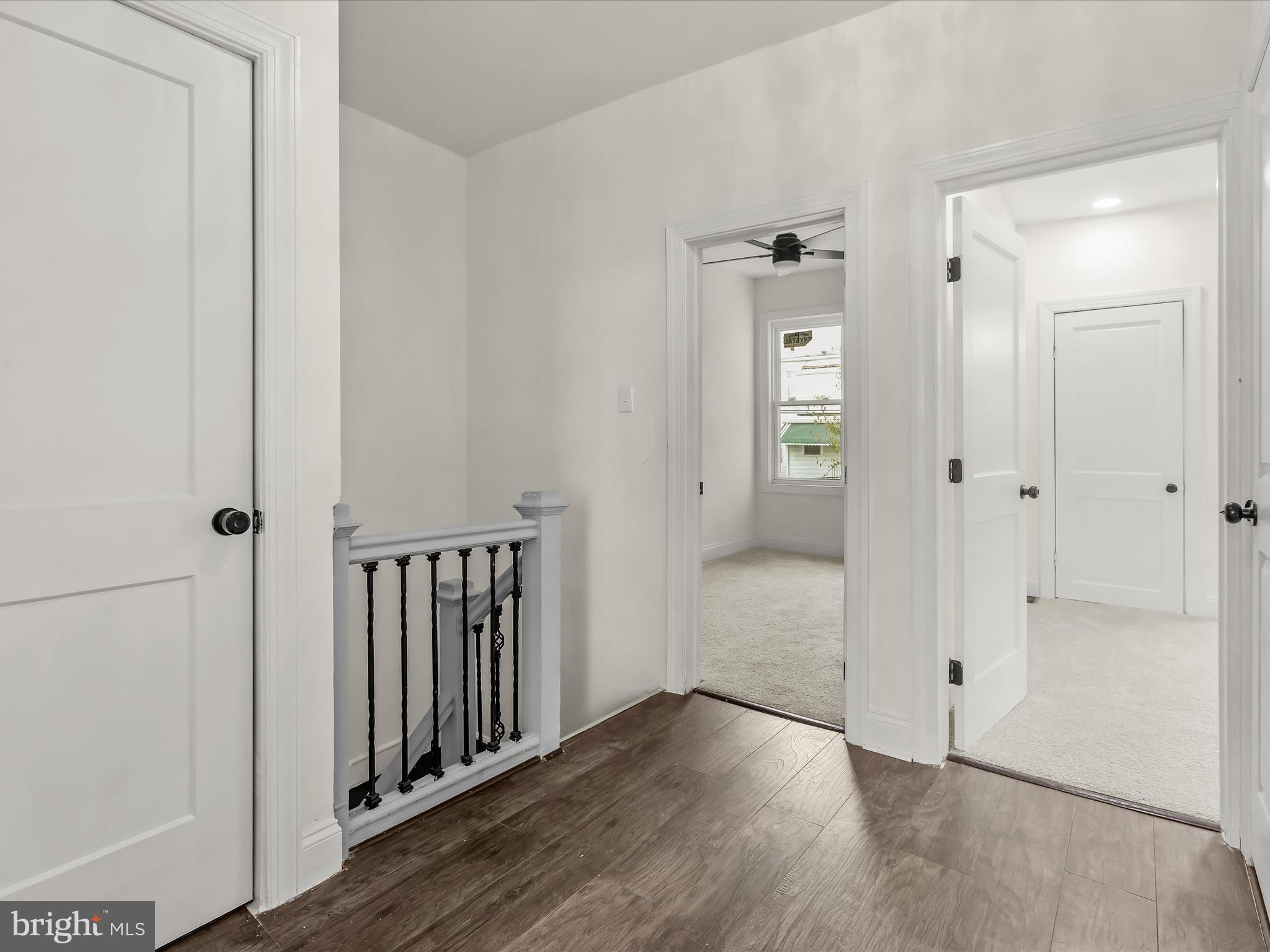 732 Edgewood Street Baltimore, MD 21229 - Photo 19 of 41 a view of a hallway with wooden floor and closet area