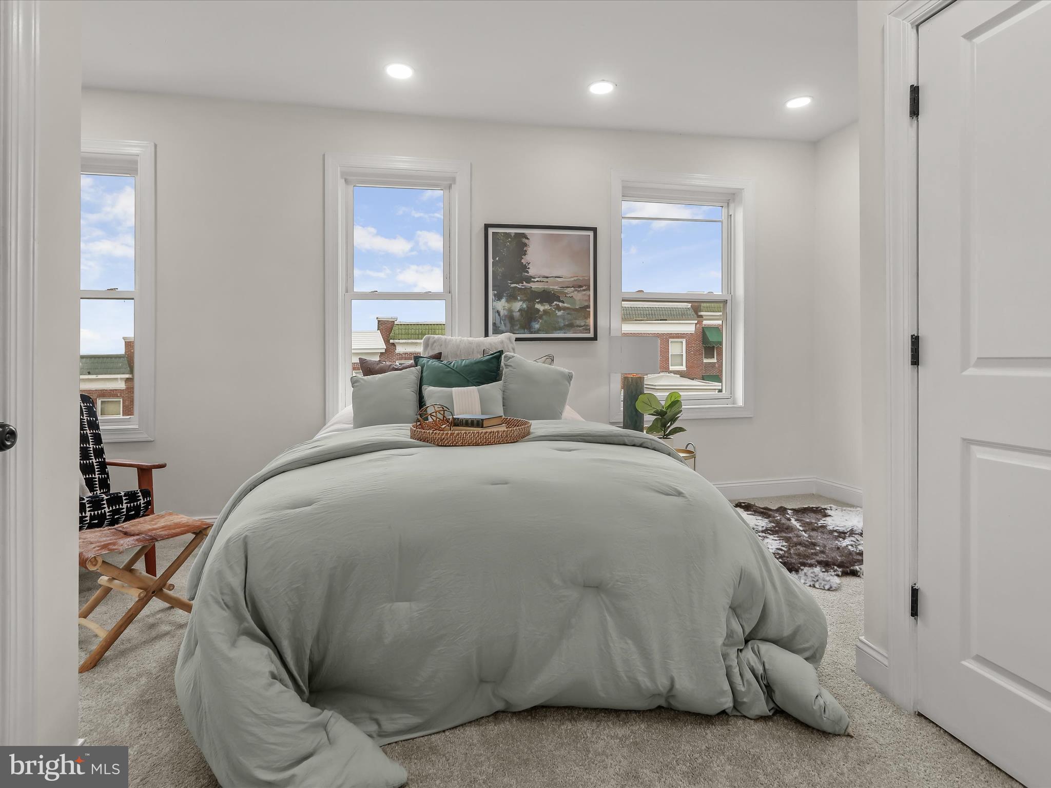 732 Edgewood Street Baltimore, MD 21229 - Photo 20 of 41 a spacious bedroom with a bed and window
