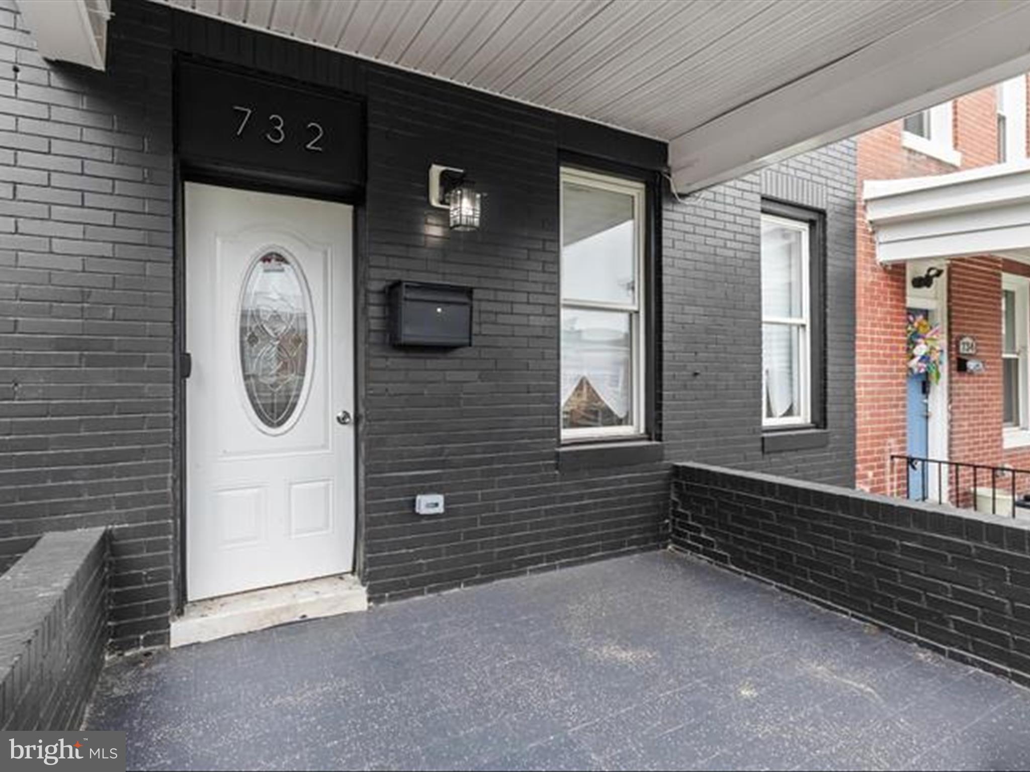 732 Edgewood Street Baltimore, MD 21229 - Photo 2 of 41 a front view of a house with a tree