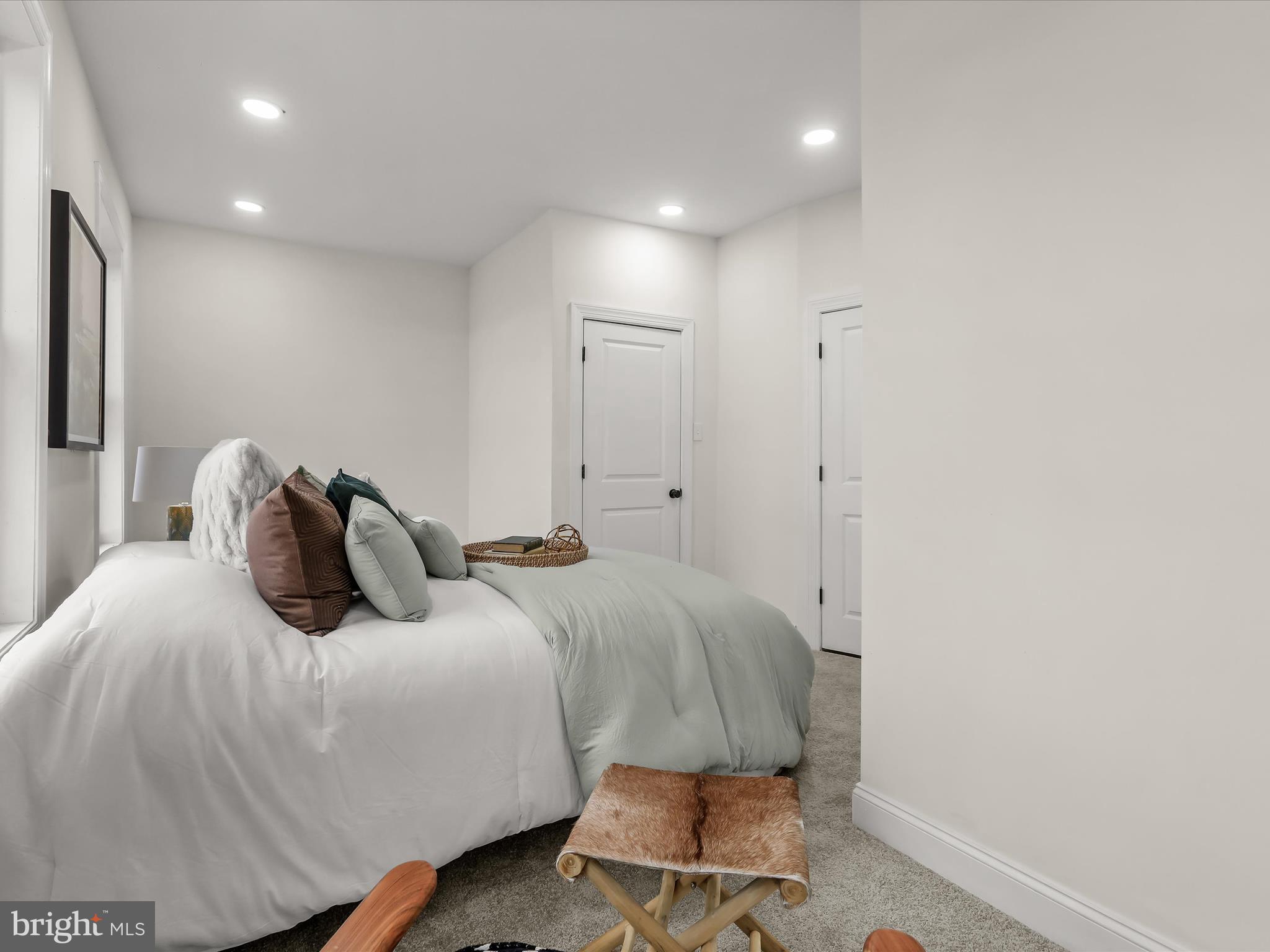 732 Edgewood Street Baltimore, MD 21229 - Photo 22 of 41 a bedroom with a bed and a chair