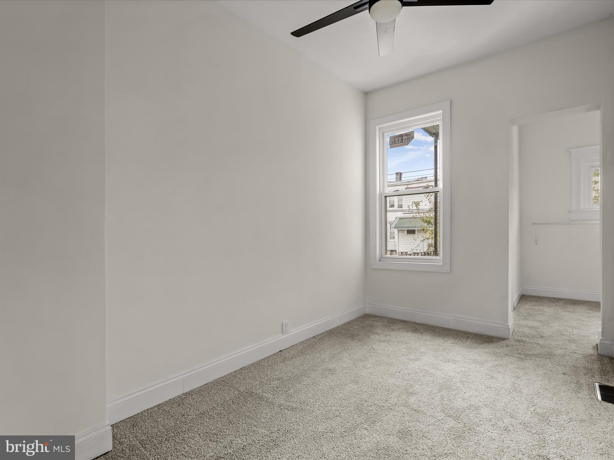 732 Edgewood Street Baltimore, MD 21229 - Photo 24 of 41 an empty room with windows