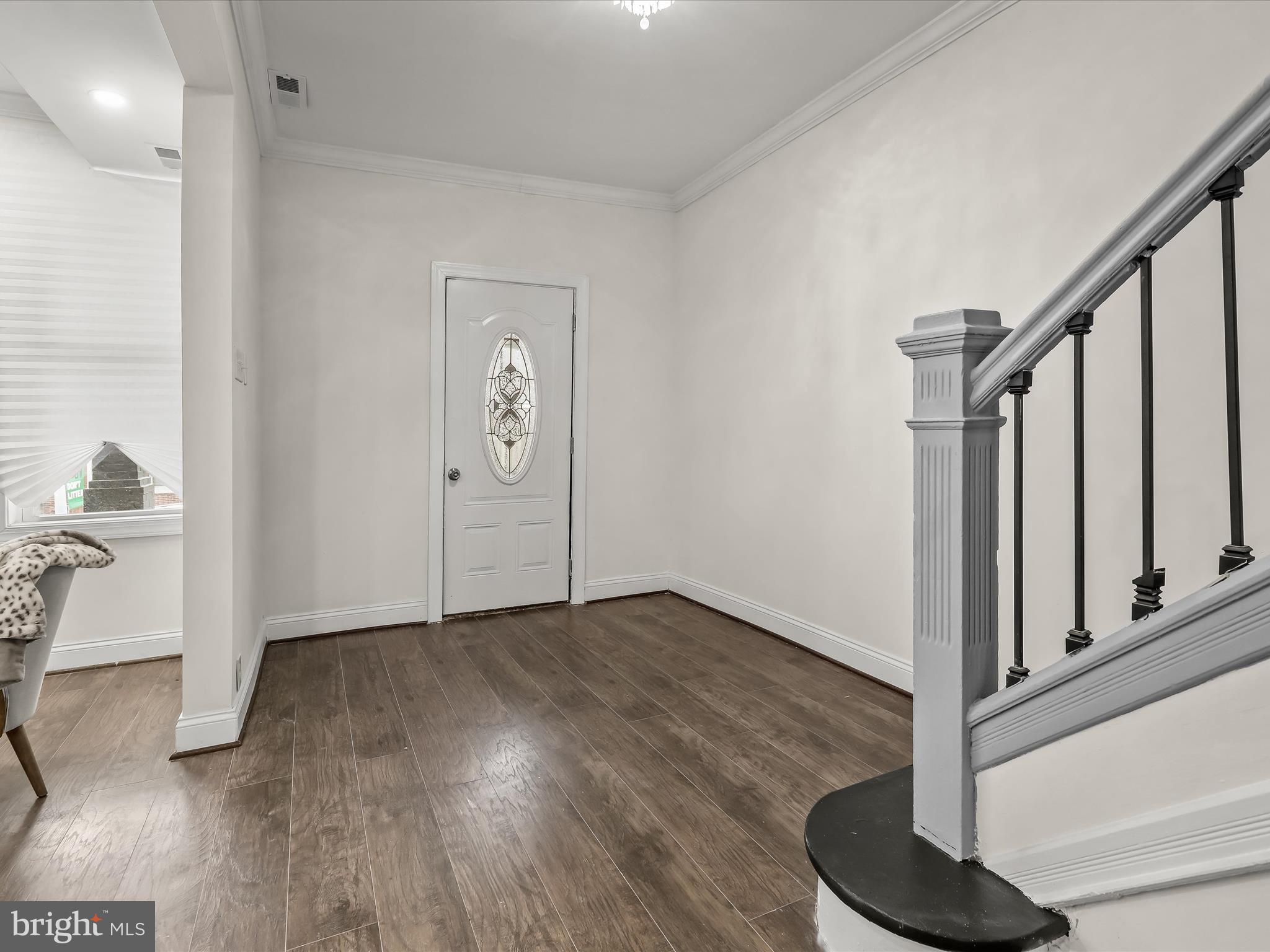 732 Edgewood Street Baltimore, MD 21229 - Photo 5 of 41 a view of an entryway with wooden floor