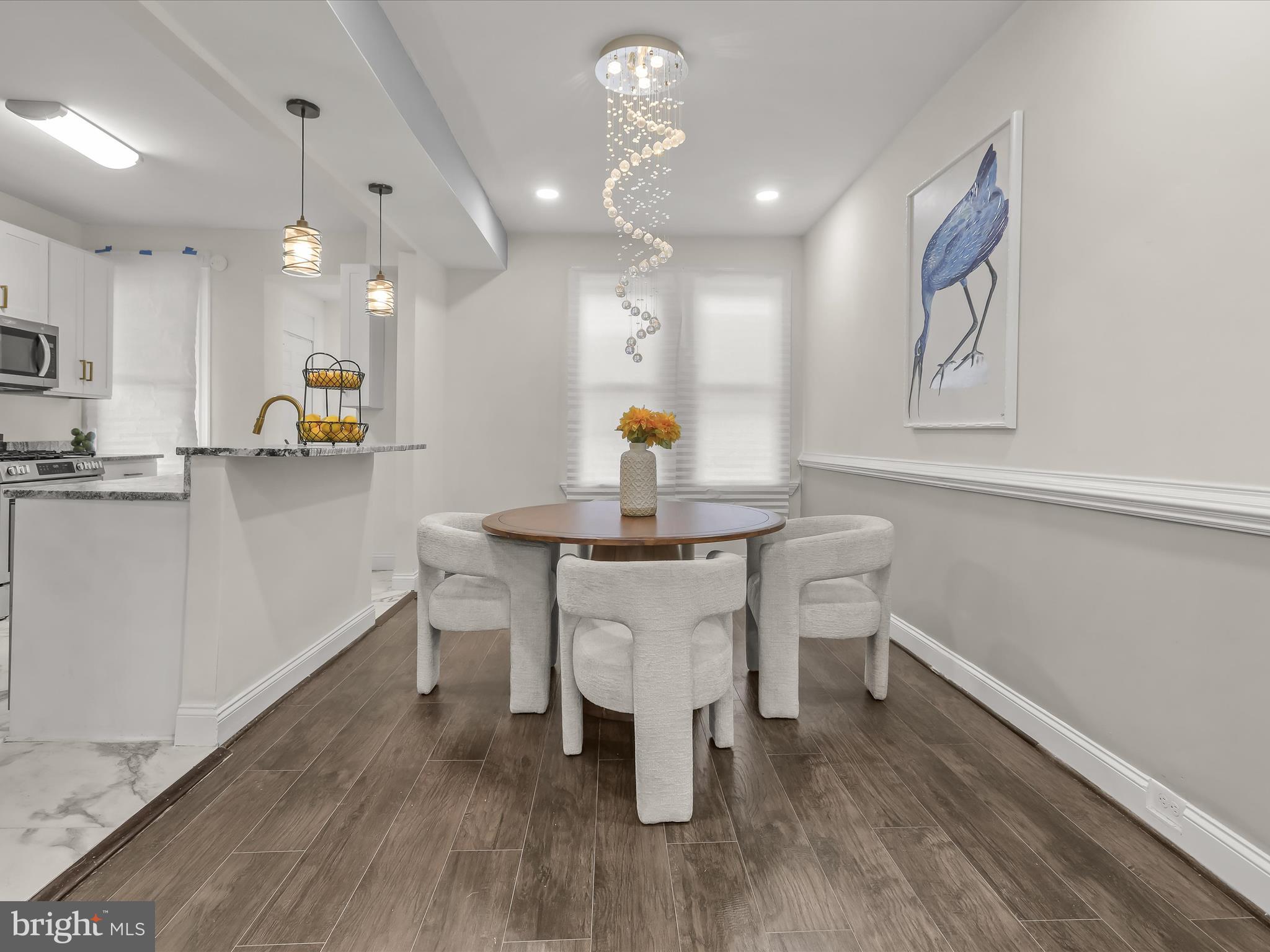 732 Edgewood Street Baltimore, MD 21229 - Photo 10 of 41 a kitchen with a sink cabinets and wooden floor