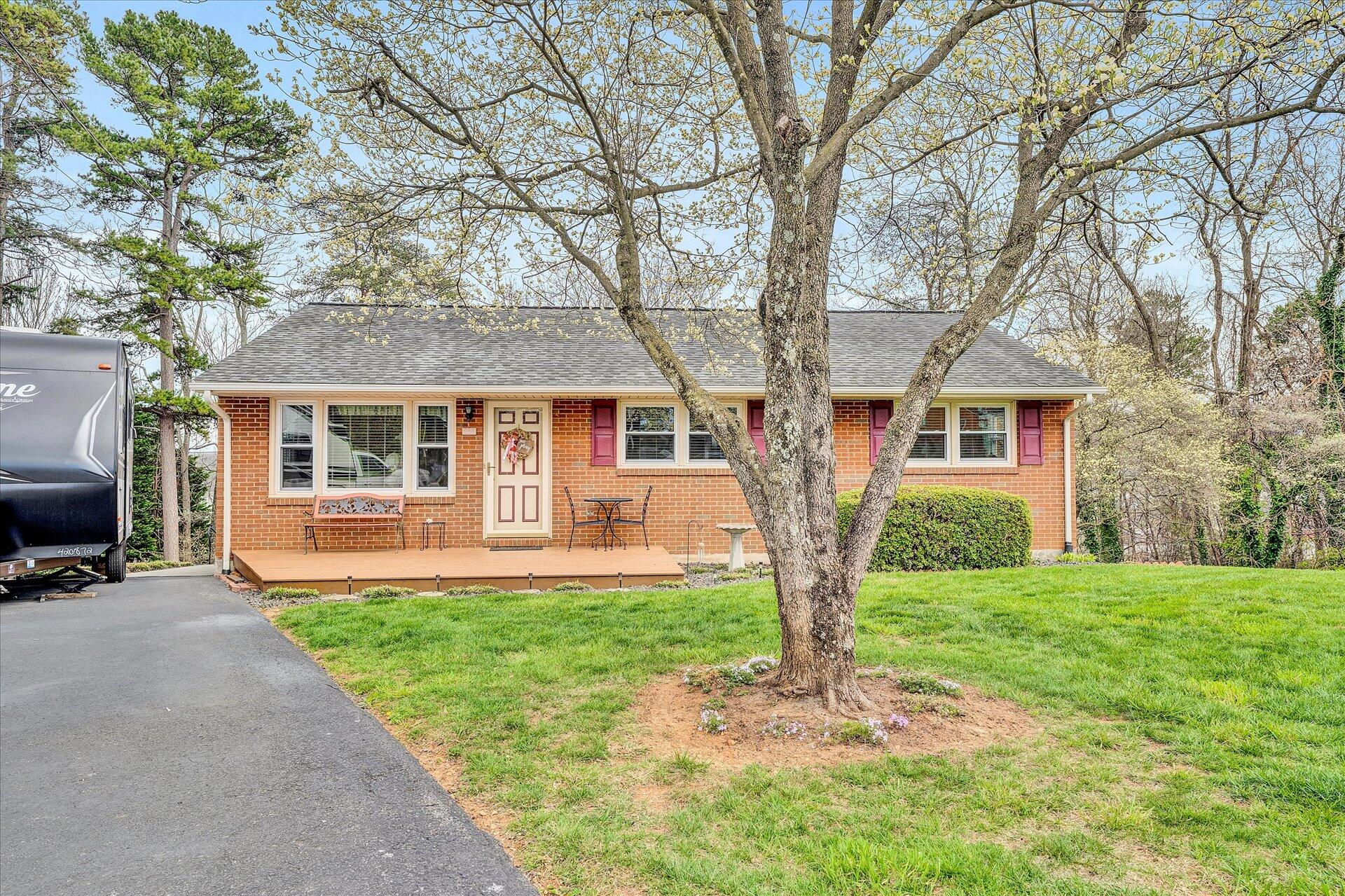 111 Deep Dell Road Salem, VA 24153 - Photo 1 of 39 a front view of a house with yard patio and green space