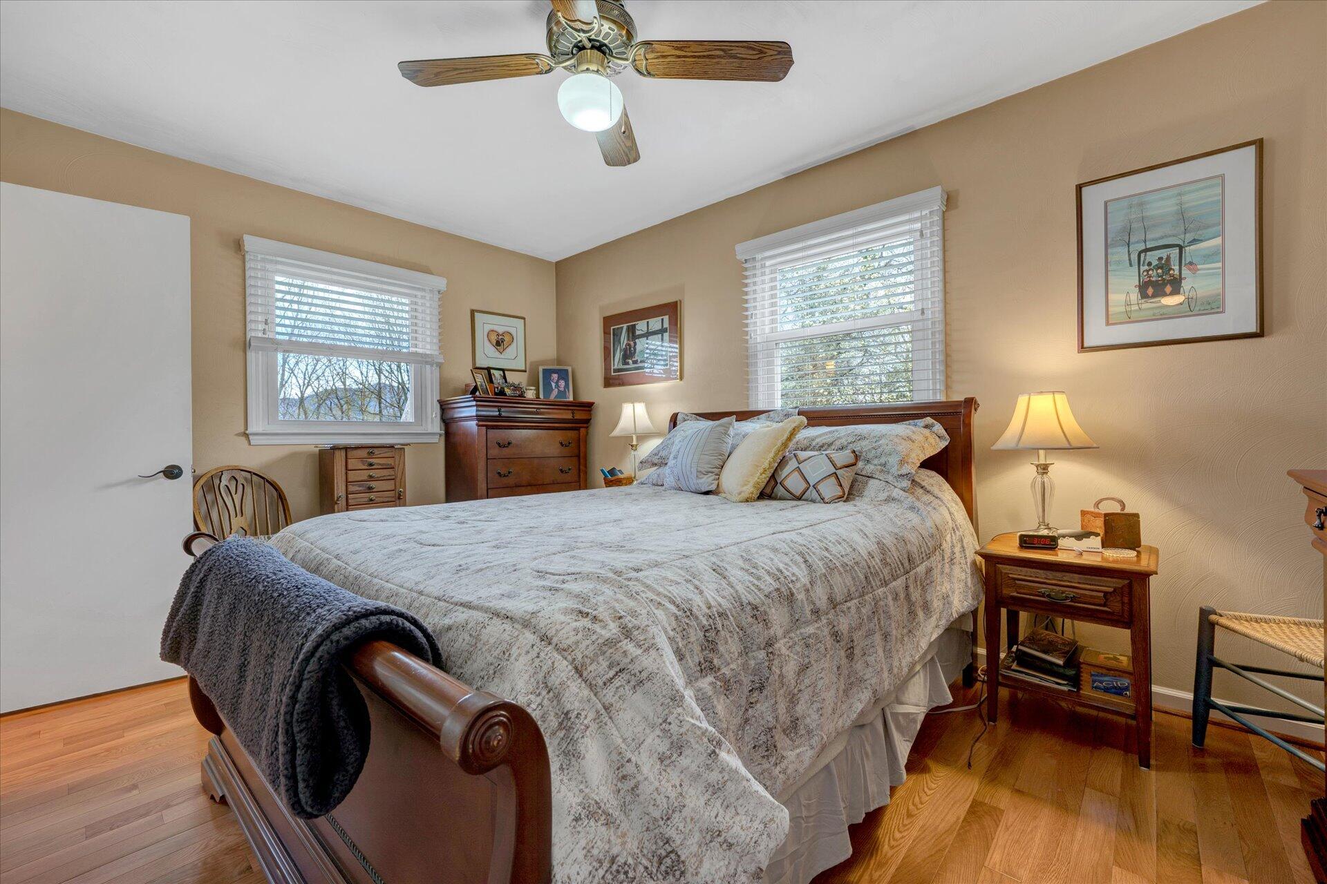 111 Deep Dell Road Salem, VA 24153 - Photo 13 of 39 a bedroom with a bed and a chandelier