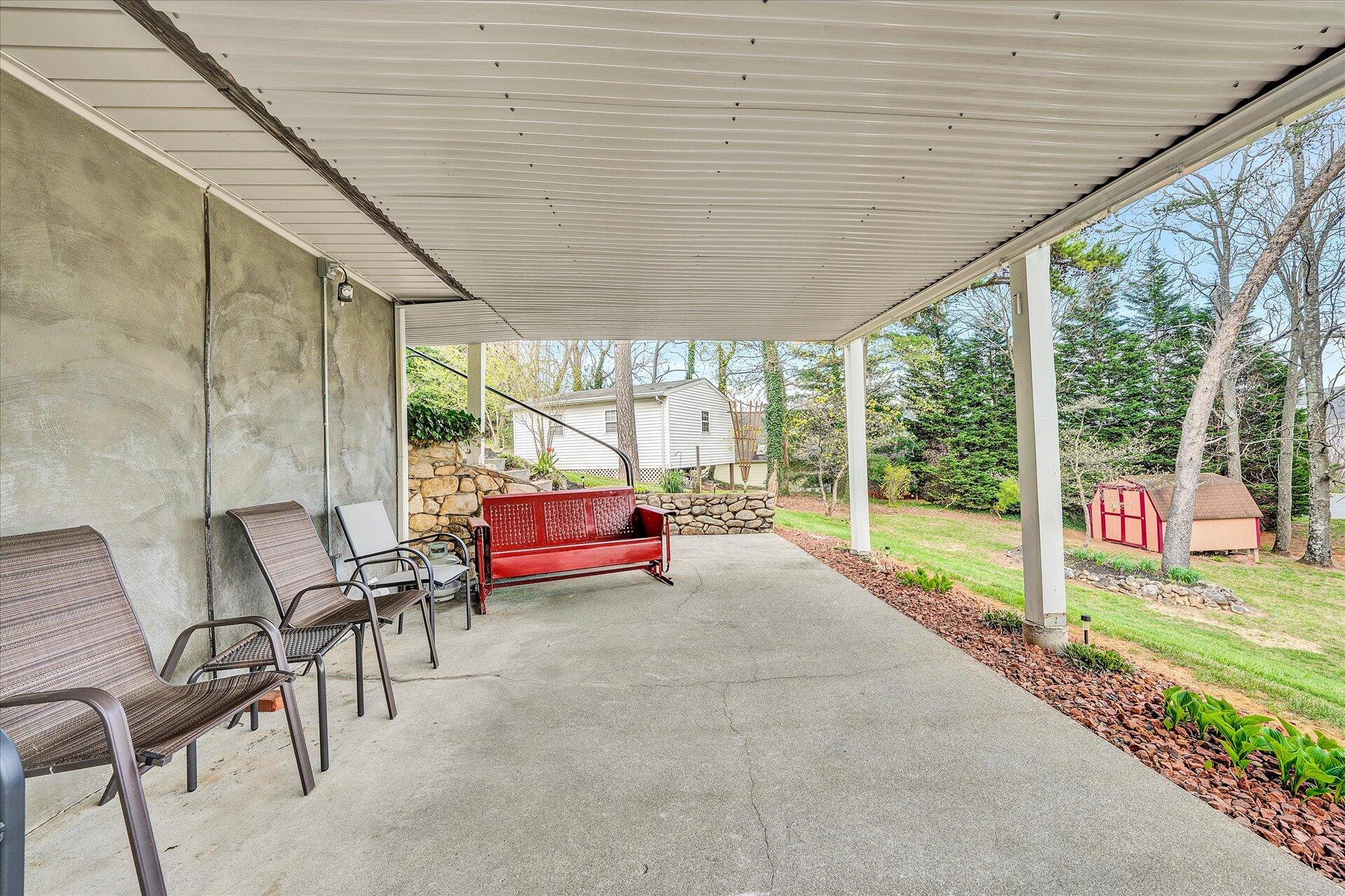 111 Deep Dell Road Salem, VA 24153 - Photo 29 of 39 a view of a patio with table and chairs and floor to ceiling window