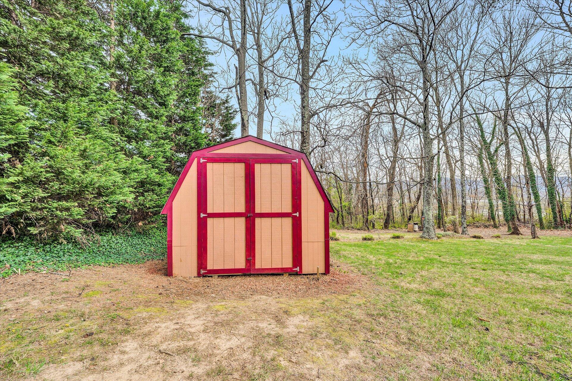 111 Deep Dell Road Salem, VA 24153 - Photo 37 of 39 a view of backyard with large trees and wooden fence