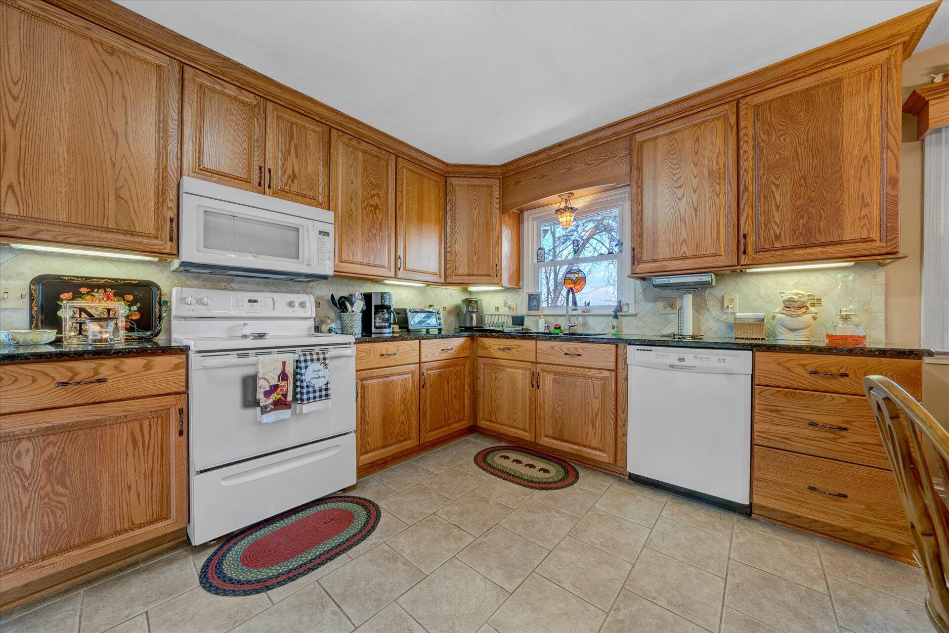 111 Deep Dell Road Salem, VA 24153 - Photo 7 of 39 a kitchen with a stove white cabinets and a sink