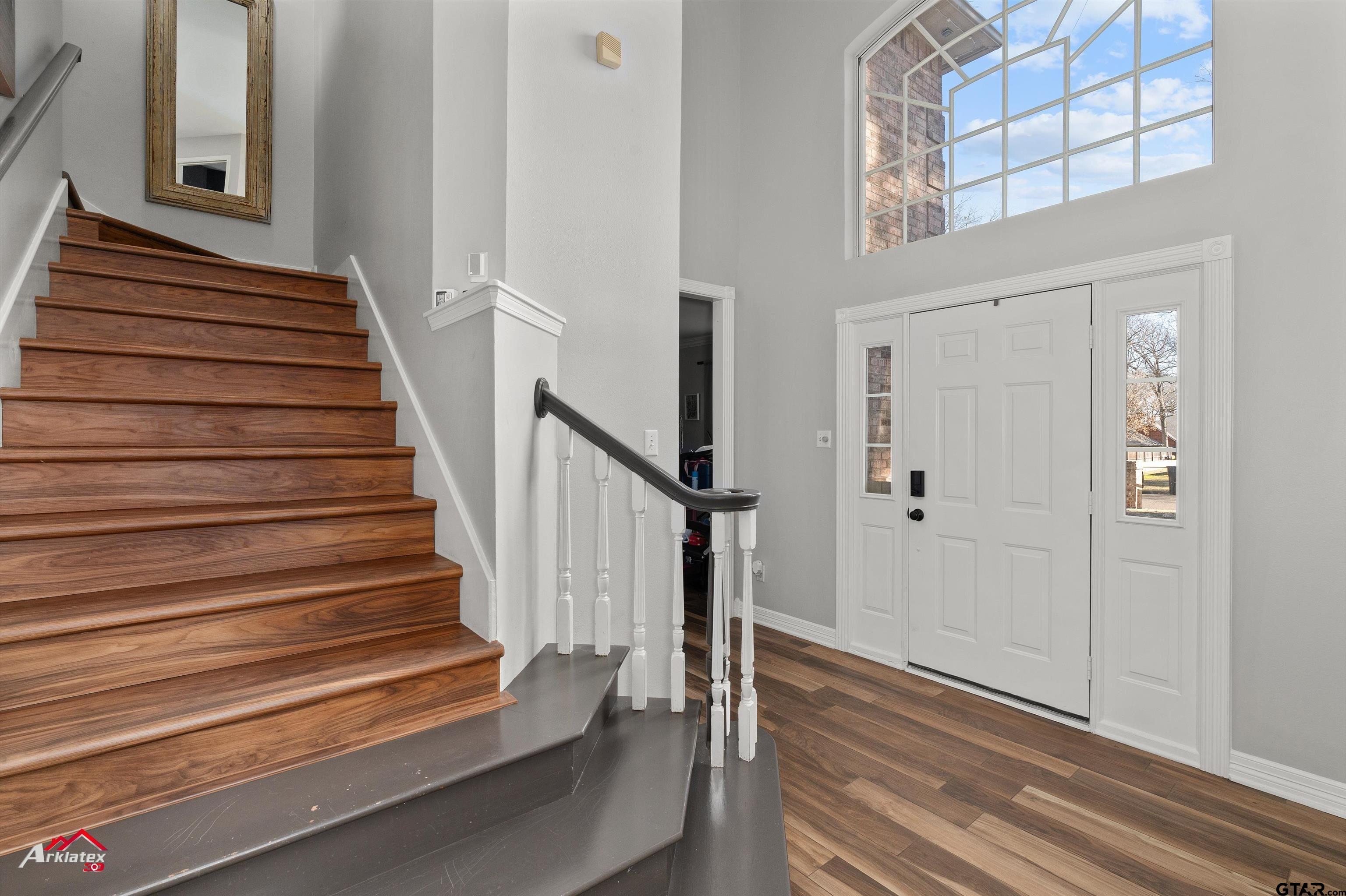3815 Holly Ridge Drive Longview, TX 75605 - Photo 6 of 22 a view of entryway with wooden floor and stairs