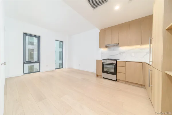 a view of a kitchen with a sink cabinets and a window