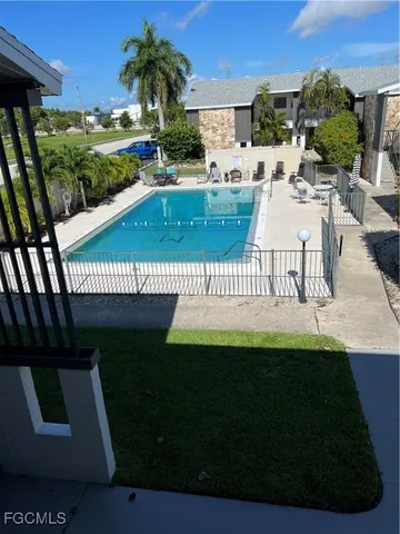 a view of a swimming pool and deck