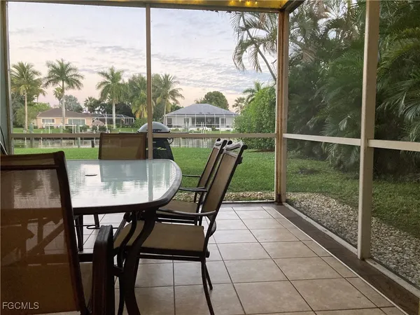 a view of a balcony with table and chairs