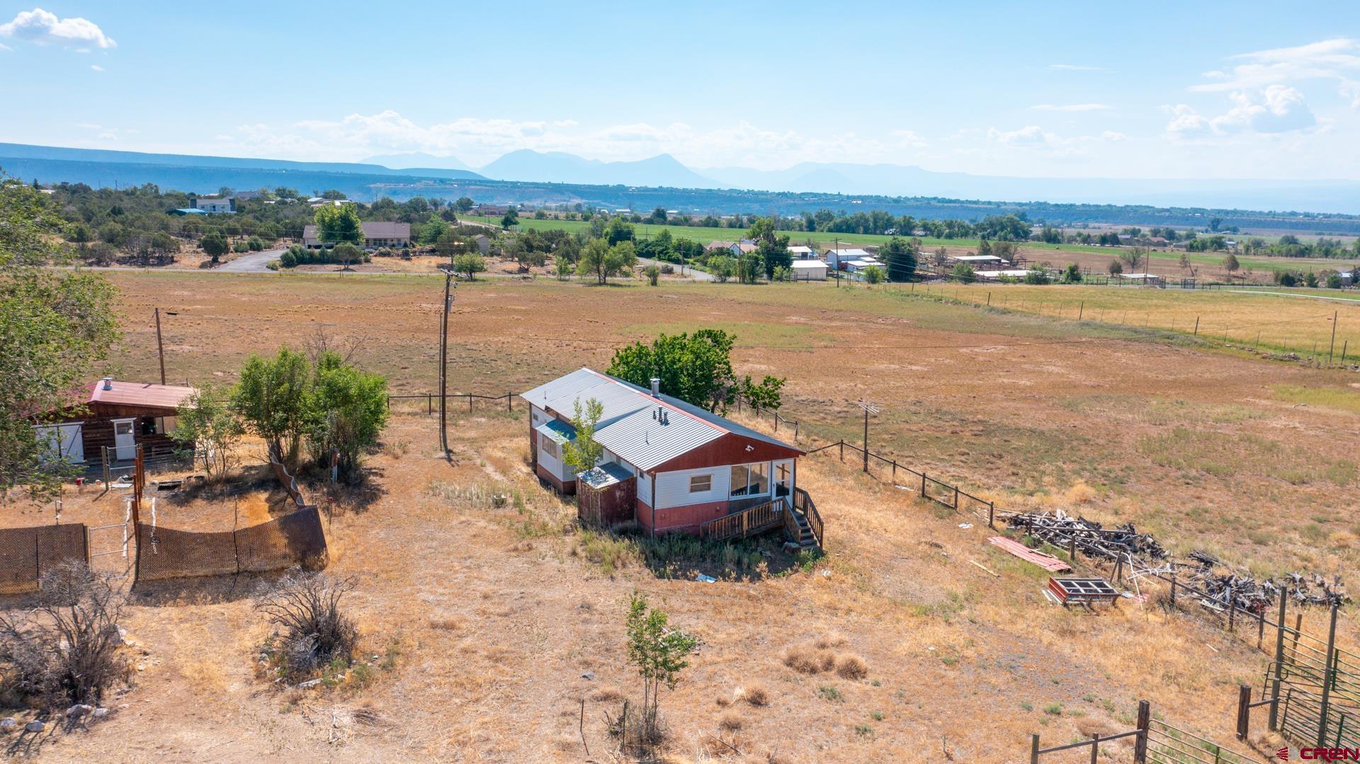 25186 Cedar Mesa Road Cedaredge, CO 81413 - Photo 6 of 17 a view of a city with ocean view