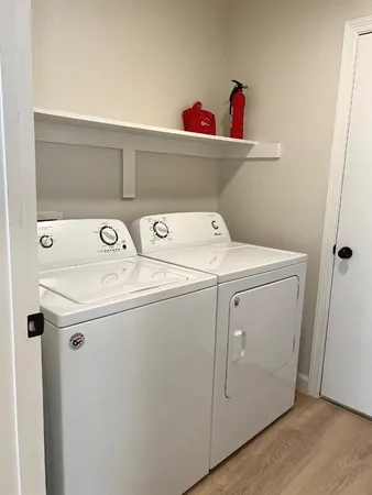 a utility room with dryer and washer