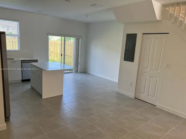 a kitchen with a sink a stove and refrigerator