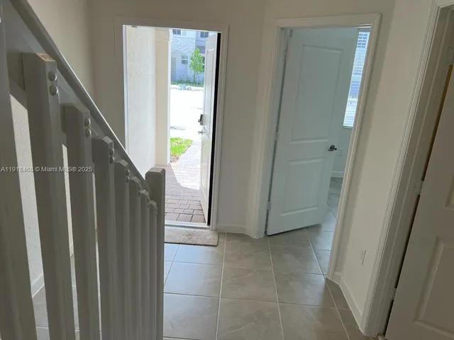 a view of a hallway with stairs
