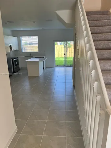 a bathroom with a sink and a window