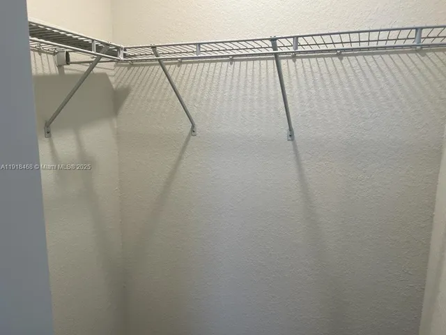 a spacious bathroom with a large window and a bathtub