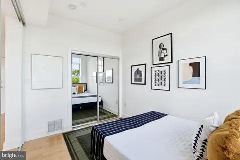 a bedroom with a bed and a table