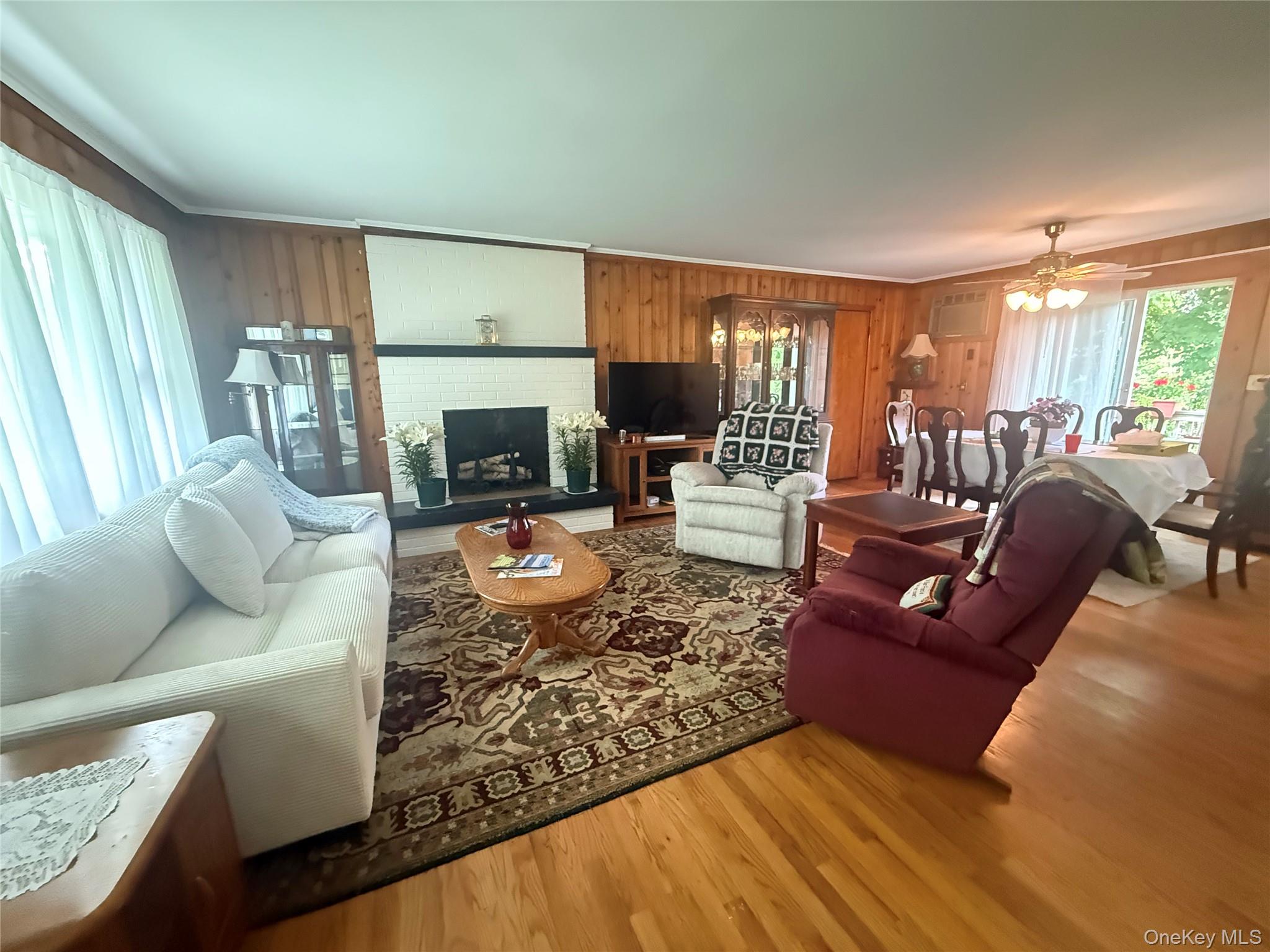 75 Midway Road Amenia, NY 12501 - Photo 2 of 15 a living room with furniture fireplace and a large window