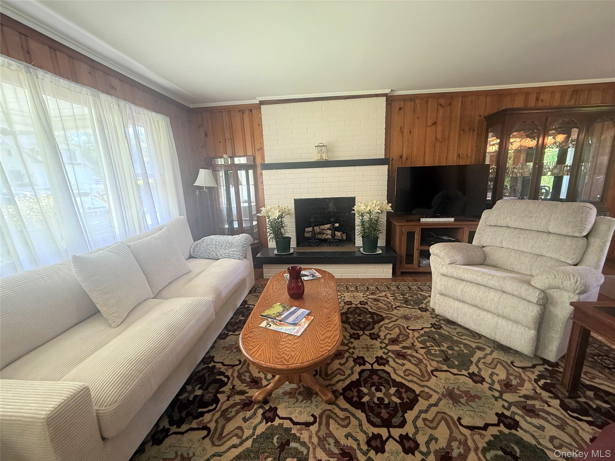 75 Midway Road Amenia, NY 12501 - Photo 4 of 15 a living room with furniture a fireplace and a window