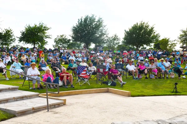 a view of a swimming pool and a yard