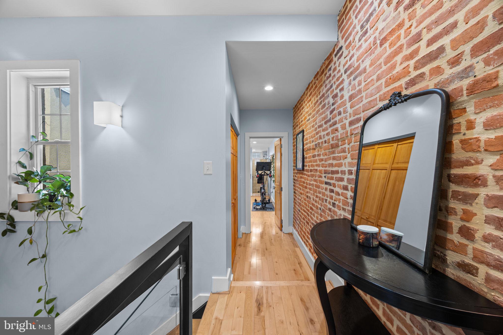 3208 Elliott Street Baltimore, MD 21224 - Photo 28 of 42 a view of a hallway with furniture and a potted plant