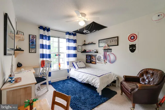 a bedroom with furniture and a bed