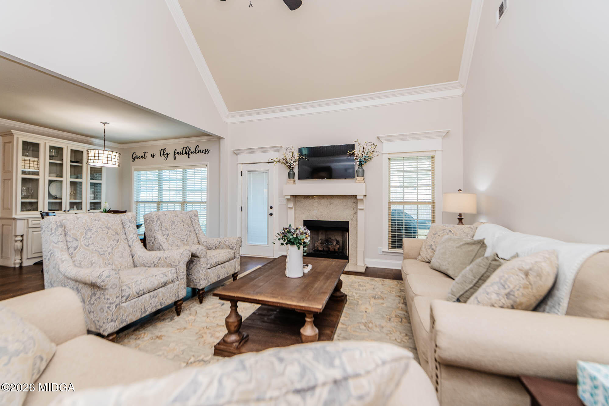112 Bainbridge Lane Perry, GA 31069 - Photo 18 of 37 a living room with furniture a fireplace and a flat screen tv