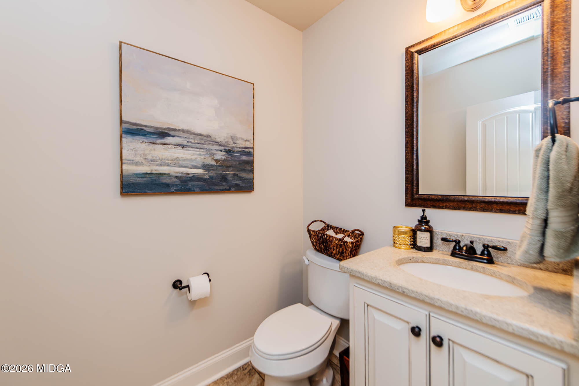 112 Bainbridge Lane Perry, GA 31069 - Photo 27 of 37 a bathroom with a toilet sink and mirror