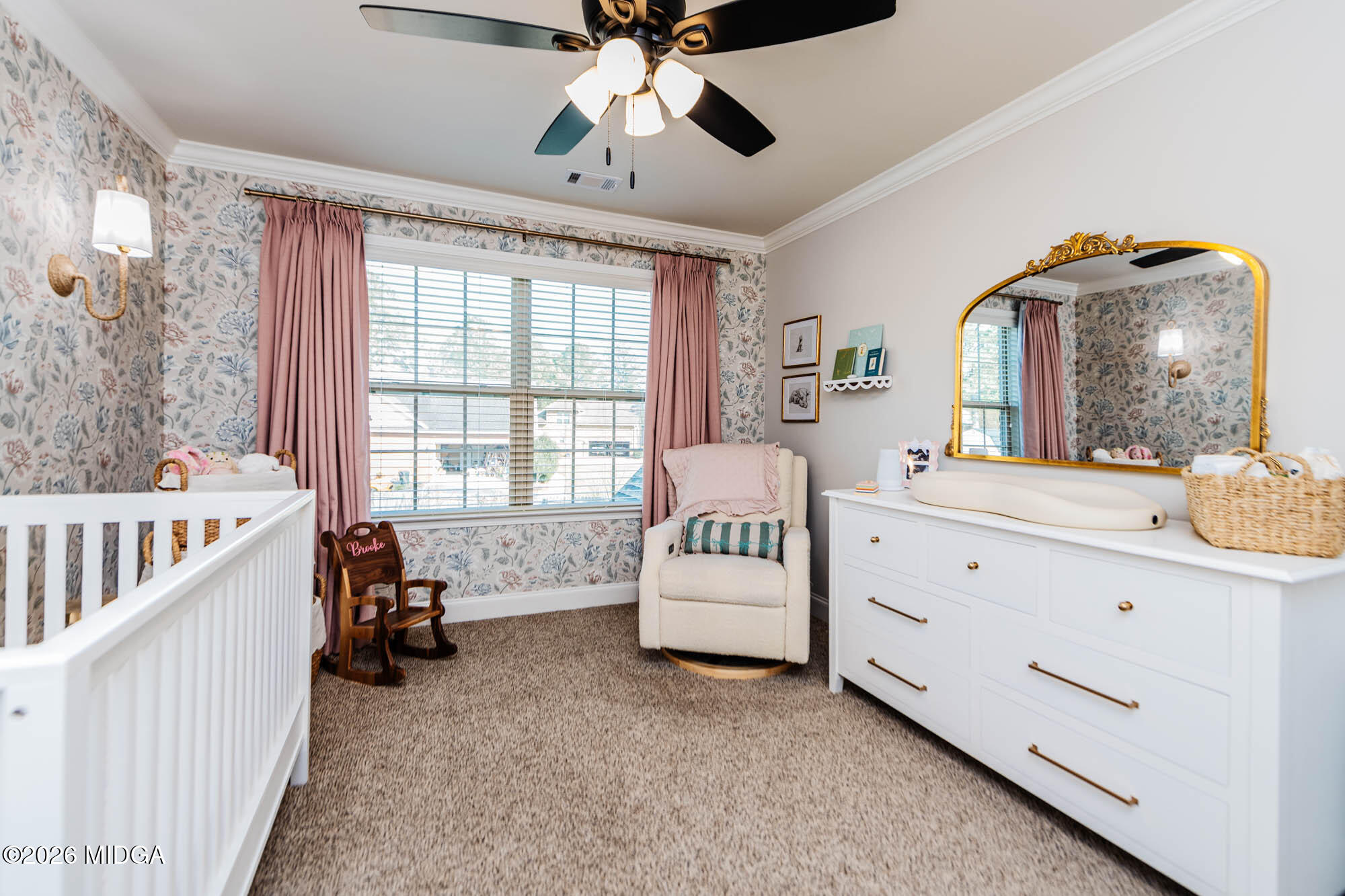112 Bainbridge Lane Perry, GA 31069 - Photo 33 of 37 a spacious bedroom with a bed and a chandelier